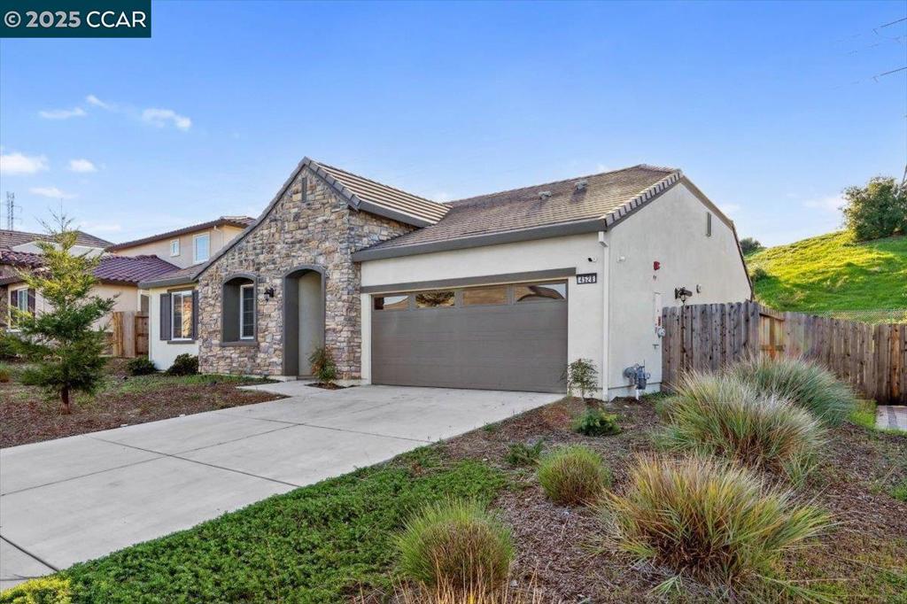 Welcome to this Beautiful Single-Story Home featuring 4-bedroom, 2.5-bathroom home offers a spacious open floor plan that effortlessly blends style and function. The living room flows seamlessly into the kitchen, boasting high ceilings, recessed lighting, and a large island with granite countertops. With generous cabinet and pantry space, stainless steel appliances, the kitchen is perfect for both cooking and entertaining. Plus, enjoy easy access to the patio and yard, ideal for outdoor gatherings. The primary suite is complete with a large closet and a spa-like bathroom featuring double sinks, a separate tub, and shower. Additional features include a tankless water heater and seller-owned solar panels for energy efficiency. Don’t miss the opportunity to make this beautiful home yours!