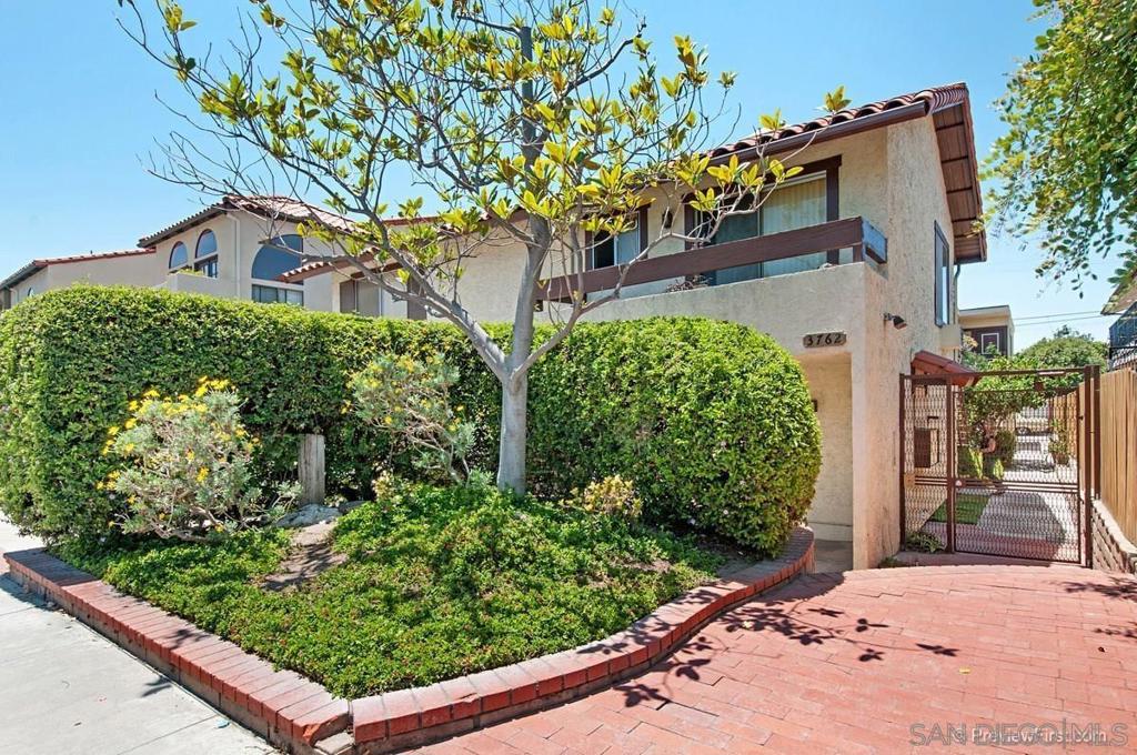 Welcome to the heart of North Park, one of San Diego’s most vibrant and sought-after neighborhoods. Located near Balboa Park, you’ll be surrounded by an eclectic mix of delicious restaurants, charming boutiques, and lively pubs and breweries. This home offers an open and airy layout where the living room, dining area, and kitchen flow seamlessly together. The living space showcases stylish bamboo-style laminate flooring throughout the main areas and one bedroom. The kitchen is a bright, welcoming space with tile floors, custom wood and glass cabinets, and a garden window for added charm. Additional perks include an in-unit stacked washer/dryer and a handy linen closet. The spacious master suite features a walk-in closet and its own private bathroom. A generously sized third bedroom connects to a Jack and Jill bath, and opens up to a quiet, private patio through sliding glass doors. Plus, you'll have the convenience of an attached garage with direct access from the home. Don’t miss your chance to live in this dynamic urban neighborhood, just minutes from all the best amenities North Park has to offer!