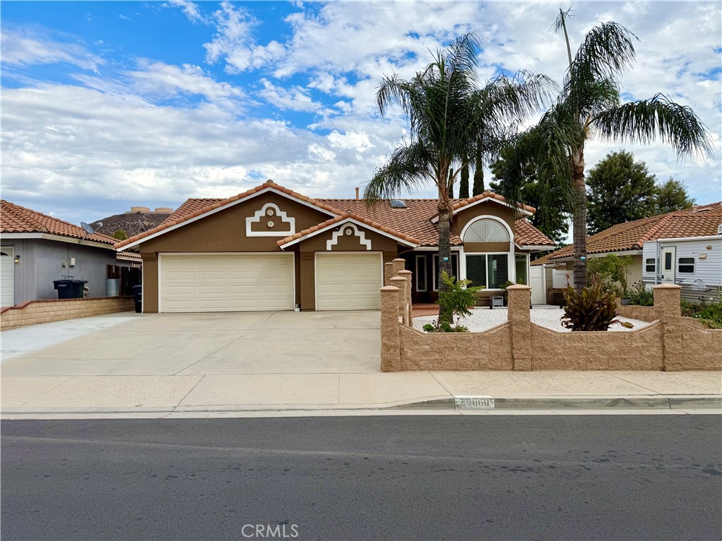 Welcome to 29060 Palmview St., a beautifully upgraded single-story home offering 4 bedrooms, 2 bathrooms, 1,924 sq. ft. of living space and a 7,405 sq. ft. lot with RV/boat parking and a 3-car garage. The exterior features low-maintenance landscaping with white rock, mature palm trees, stackable cinderblock planters, vinyl gates, Spanish tile roof, and rain gutters routed underground. Inside, natural light fills the home through dual-pane windows, sliders, and a skylight in the living room. Enjoy large tile flooring, recessed lighting, updated outlets and switches, and a cozy gas brick fireplace. The remodeled kitchen showcases shaker-style cabinets, quartz countertops, sleek glass backsplash, LED undercabinet lighting, and black stainless steel Samsung appliances—all included. Spacious bedrooms feature upgraded carpet and ceiling fans. Both bathrooms have been remodeled with new vanities, tile, toilets, and showers. The primary suite offers vinyl flooring, his and her closets, private patio access, and a beautifully updated bathroom. Outdoor living includes two patios—one enclosed with tile and another with recessed lighting—plus new concrete hardscape, brickwork, upgraded drainage, and fruit trees including two lemon, sweet lime, blood orange, pomegranate, fig, peach, plum and some pepper plants! Conveniently located near schools, shopping, dining, and Lake Elsinore recreation. Don't miss this opportunity!