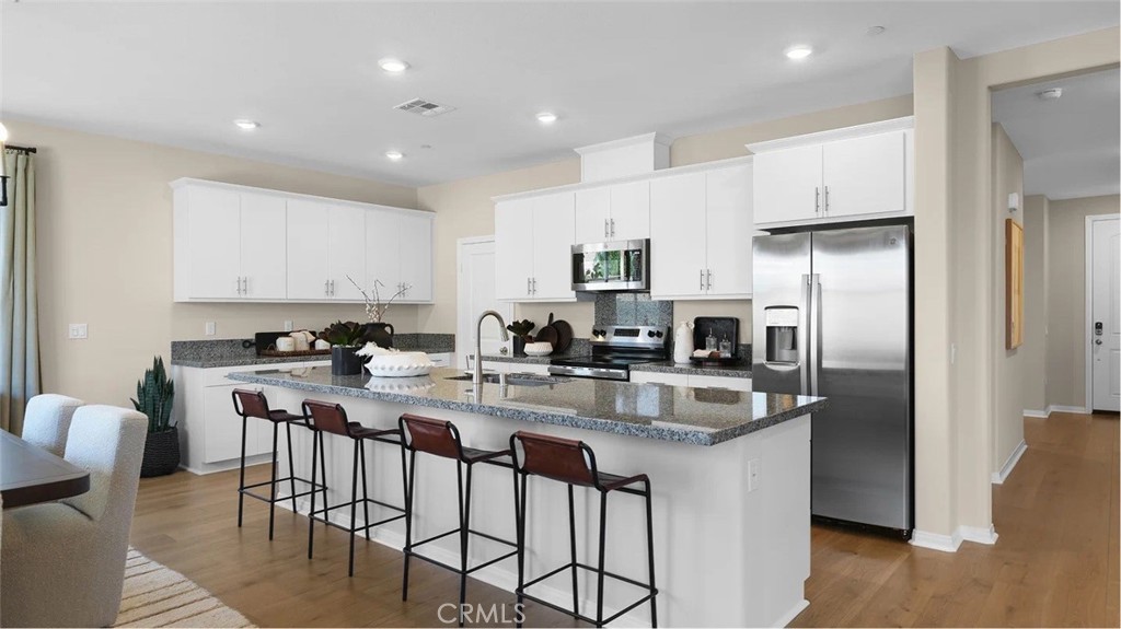 NEW CONSTRUCTION! Includes Upgraded Flooring! This new two-story home features an inviting open-concept layout on the first floor, blending the kitchen, living and dining areas for simple transitions and multitasking, and a bedroom and full bathroom are secluded off the foyer. On the second floor, a versatile loft provides a shared living space easily accessible from three bedrooms and a luxe owner’s suite, complete with a full bathroom and walk-in closet. The kitchen features new caledonia granite counters and white cabinetry.
Estrella is a gated community of brand-new single-family homes for sale, coming soon to Moreno Valley, CA. Residents will enjoy access to onsite amenities, including a pocket park with shade structures, a tot lot and BBQ area. Estrella is located near the March Air Reserve Base, perfect for military families and personnel. Head over to the Lake Perris State Recreation Area to enjoy the outdoors, with opportunities to boat, hike and more, or enjoy endless recreation options at nearby Lasselle Sports Park.