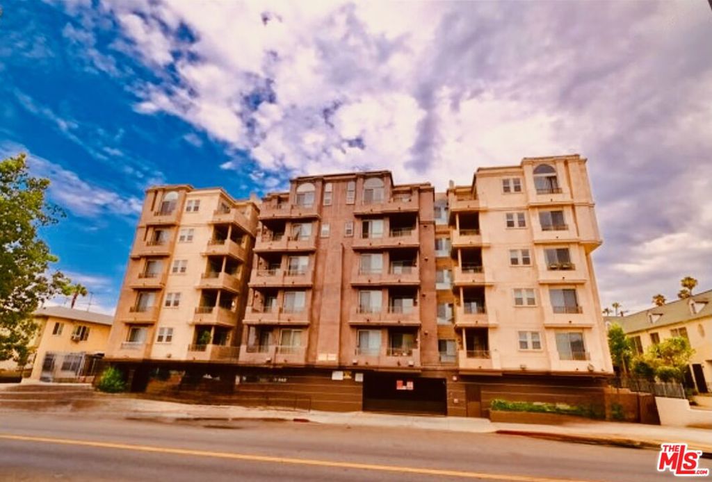 Experience unbeatable value with this beautifully upgraded 2-bedroom, 2-bathroom condominium, perfectly located in the vibrant Mid-Wilshire/Koreatown area. Situated on the 3rd floor of a gated, secure building, this home offers city light views and a spacious private balconyan ideal spot to unwind after a long day.Step inside through the keypad entry and into a bright, open living space with modern finishes and thoughtful details. The living room is filled with natural light and features waterproof luxury vinyl plank flooring. The updated kitchen boasts quartz countertops, a breakfast bar, sleek cabinetry, a stylish backsplash, and stainless steel appliances. For convenience, the unit comes with its own washer and dryer. The primary suite includes a walk-in closet and a private en-suite bathroom with quartz counters, tiled flooring, and a tub/shower combo. The second bedroom and full bathroom are generously sized, perfect for family, roommates, or a home office. Residents can enjoy access to building amenities such as a fitness center, recreation room, dual elevators, guest parking, and gated security parking with assigned tandem spaces. Water and trash are included. Ideally located just moments from trendy restaurants, supermarkets, shopping, schools, pharmacies, and the Wilshire/Normandie Metro station, this condo offers the perfect combination of comfort, style, and convenience.