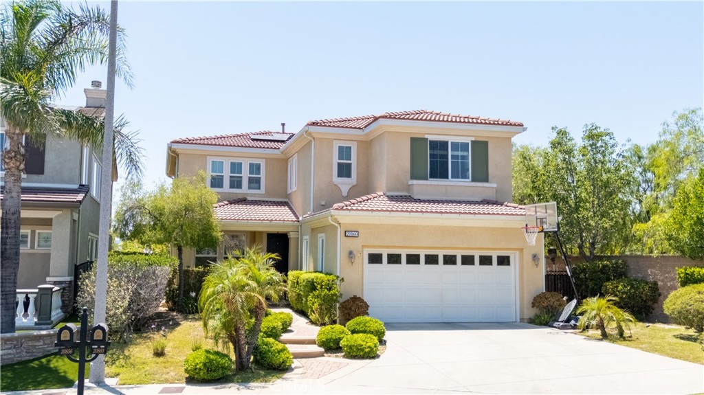 Welcome to this spacious, 24-hour gate-guarded home located in the prestigious Sorrento community of Porter Ranch. This beautiful 4-bedroom, 3-bath residence offers a bright and open layout, beginning with a generous living room that welcomes you upon entry. The kitchen is equipped with an island, double oven, dishwasher, and a large refrigerator, ideal for both everyday living and entertaining. A convenient laundry room is also located inside. All four bedrooms are upstairs, a spacious loft with office, including a primary suite featuring a large en-suite bathroom with a separate soaking tub, walk-in shower, and dual sinks. Additional highlights include an attached 3-car garage and a beautifully landscaped backyard with peaceful canyon views. The Sorrento community offers resort-style amenities, including two sparkling pool and spa areas. Located within the highly sought-after Porter Ranch Community School boundary (K-8, per LAUSD), and just minutes from the prestigious Sierra Canyon private school. Enjoy easy access to the vibrant Vineyards Shopping Center, home to Lure Fish House, Finney’s, Patxi’s Pizza, Nordstrom Rack, a state-of-the-art AMC theater, Whole Foods, and more. This is Porter Ranch living at its finest!