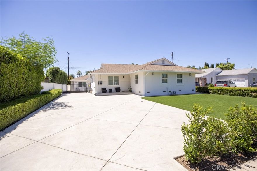 Welcome to this stunning single-story residence located in the heart of Mission Hills. This beautifully updated home features 3 spacious bedrooms, 2 bathrooms, and approximately 1400 square feet of thoughtfully designed living space.

Inside you will find a bright and open layout accented by elegant wide-plank flooring, recessed lighting, and designer finishes throughout. The expansive living room flows seamlessly into the dining area and modern kitchen, complete with sleek countertops, stainless steel appliances, and ample cabinetry for all your storage needs. A separate laundry room with built-in storage adds everyday convenience.

The primary suite offers a peaceful retreat with abundant natural light, while the two additional bedrooms are generously sized for comfort and versatility. Enjoy indoor-outdoor living with a cleanly landscaped yard, ample driveway space, and a gated entrance for added privacy and security.

Perfectly positioned near top shopping, dining, and major commuter routes, this home blends comfort, style, and convenience in one of Mission Hills' most desirable neighborhoods.