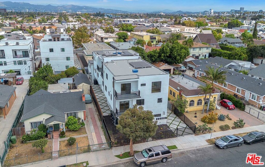 MASTER LEASE-Welcome to 4701 Saturn Street, a gorgeous Non Rent Controlled, High End Brand New 2025 Construction Six Unit with incredible 180 degree views of Century City, Hollywood Hills and Downtown .The property is located in the ultra trendy Mid-City area, just minutes from Culver City, West Adams and highly desirable area due to its centrality and walkability to coffee shops, grocery stores like Target, Sprouts, gyms, shops, entertainment district and many trendy restaurants. The building features an attractive unit mix of Four-3 bedrooms 3 baths, 1-5 bedroom 5 baths, and 1- 2 bedroom 2 bath. Each unit feature's efficient open floor plans with huge bedrooms, walk in closets, massive balconies and all units have a ton of natural light and 180 degree views from Century City and city. All the units features beautiful vinyl flooring with white cabinets, quartz white countertops, and clean sleek modern feel. Moreover, each unit has stainless steel appliances, washer and dryer in unit, designer Carrara shower tiles and each unit is separately metered. In addition, the luxury building is located just minutes from the Arts District, Helms Bakery, Cumulus which has the famous Whole Foods, Culver City Steps and Ivy Station, which is home to Apple, Amazon Studios, Sony Pictures, HBO, Beats Electronics and many more tech and entertainment companies pouring into the neighborhood. The strong and ultra hot rent desirability and comps are being achieved in this neighborhood, largely due to the by the surrounding tech hubs, providing high-paying salary jobs. Mid-City overall is a very hot market, its centralized location makes it convenient to get all neighborhoods such as Miracle Mile, The Grove, West Hollywood, Beverly Hills, Century City, Culver City, Westside/Beach cities or Downtown within minutes and much more. The neighborhood is surrounded brand new construction close by giving a modern, and nice vibrant feel to the area. ONE MONTH FREE RENT reduces the rent to $24,383 after the free rent is deducated and factored in, Base rent is $26,600.