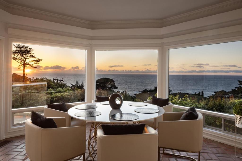 Located in the elevated Carmel Highlands, Villa Fontana-the former estate of Academy Award winning actress Joan Fontaine-is perfectly perched on the hills above the Carmel coastline, boasting sweeping views of the Pacific Ocean and the marine-rich details of Point Lobos. Set on a ~1 acre, Cypress studded lot, the home exudes all the elegance of old Hollywood style and charm, with gallery-like hallways and large entertaining areas. Stunning ocean views can be seen from almost every room and the large, westside decks enable effortless indoor/outdoor living, begging for alfresco dining, morning sunrise coffees, or sunset cocktails. Highlights include a gated entry, 4 bedrooms and 4.5 bathrooms, 4,712 SqFt of light and bright living space, a detached 2-car garage, a golden-era library with cozy fireplace, and open kitchen with unforgettable ocean views. Live like a movie star every day, exploring all the incredible amenities of the Monterey Peninsula, knowing that your private, coastal haven awaits your return.