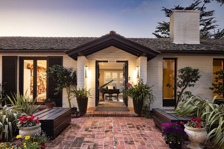 Located in the elevated Carmel Highlands, Villa Fontana-the former estate of Academy Award winning actress Joan Fontaine-is perfectly perched on the hills above the Carmel coastline, boasting sweeping views of the Pacific Ocean and the marine-rich details of Point Lobos. Set on a ~1 acre, Cypress studded lot, the home exudes all the elegance of old Hollywood style and charm, with gallery-like hallways and large entertaining areas. Stunning ocean views can be seen from almost every room and the large, westside decks enable effortless indoor/outdoor living, begging for alfresco dining, morning sunrise coffees, or sunset cocktails. Highlights include a gated entry, 4 bedrooms and 4.5 bathrooms, 4,712 SqFt of light and bright living space, a detached 2-car garage, a golden-era library with cozy fireplace, and open kitchen with unforgettable ocean views. Live like a movie star every day, exploring all the incredible amenities of the Monterey Peninsula, knowing that your private, coastal haven awaits your return.