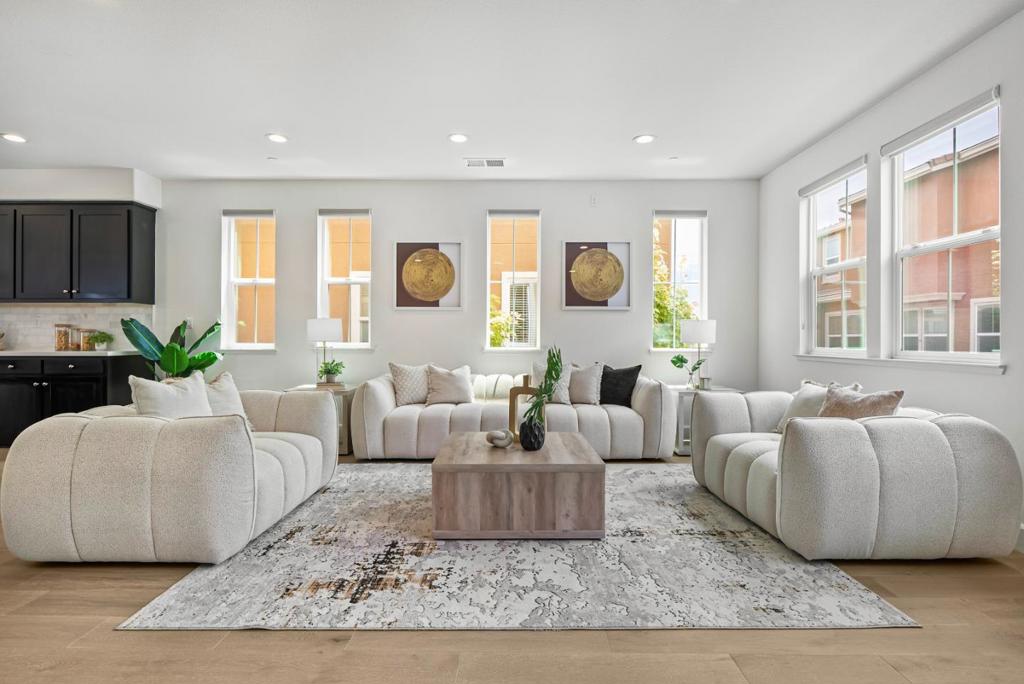 Welcome to this elegant townhome in the highly sought-after Prima community. This spacious home features two generously sized en-suites, including one conveniently located on the first floorideal for guests or multi-generational living. Enjoy upgraded finishes throughout, including quartz countertops in all three full bathrooms, with double vanities in both the primary and hallway bathrooms. Thoughtful design touches like tile flooring, plush carpeting, and stylish wrought-iron stair railings add to the homes sophisticated feel. The community offers well-maintained amenities such as children's playgrounds, lush parks, and scenic walking trails. Perfectly positioned for commuters, with easy access to I-880, Highway 84, and nearby BART stations. Just minutes from NewPark Mall, Costco, Whole Foods, AMC Theaters, dining, and more. Dont miss the chance to call this beautiful home your own!