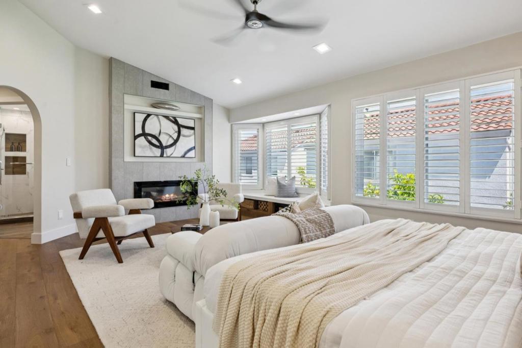 Fully Renovated in 2021 with Over $400K in Premium Upgrades by Owner who is a licensed contractor! One of Milpitas most sought-after neighborhoods and top-rated schools zone, this turnkey home blends luxurious design with everyday functionality. Ideal for remote work, entertaining, or raising a growing family, every detail has been thoughtfully curated you have to see it yourself! The chef's kitchen boasts modern style cabinetry, and a custom-built breakfast bench, perfect for casual dining or homework. Elegant wide-plank French Oak floors flow throughout. Enjoy energy-efficient Milgard Ultra fiber windows and doors with tempered glass, , whole-home Lutron Smart Lighting, and built-in closets. The spacious family room offers surround sound and a cozy fireplace ideal for movie nights or entertaining. Upstairs, retreat to a serene primary suite featuring its own fireplace, soaking tub, and oversized shower. A private guest ensuite adds flexibility for multi-gen living or visitors. Located in a family-friendly community with a sparkling pool & playground. Just a short walk to groceries, dining, and Milpitas Town Center. Easy access to Hwys 237, 880 & 680. Top-rated schools: Curtner Elem (8/10), Thomas Russell Middle (8/10), and Milpitas High (8/10). Buyer to verify enrollment.