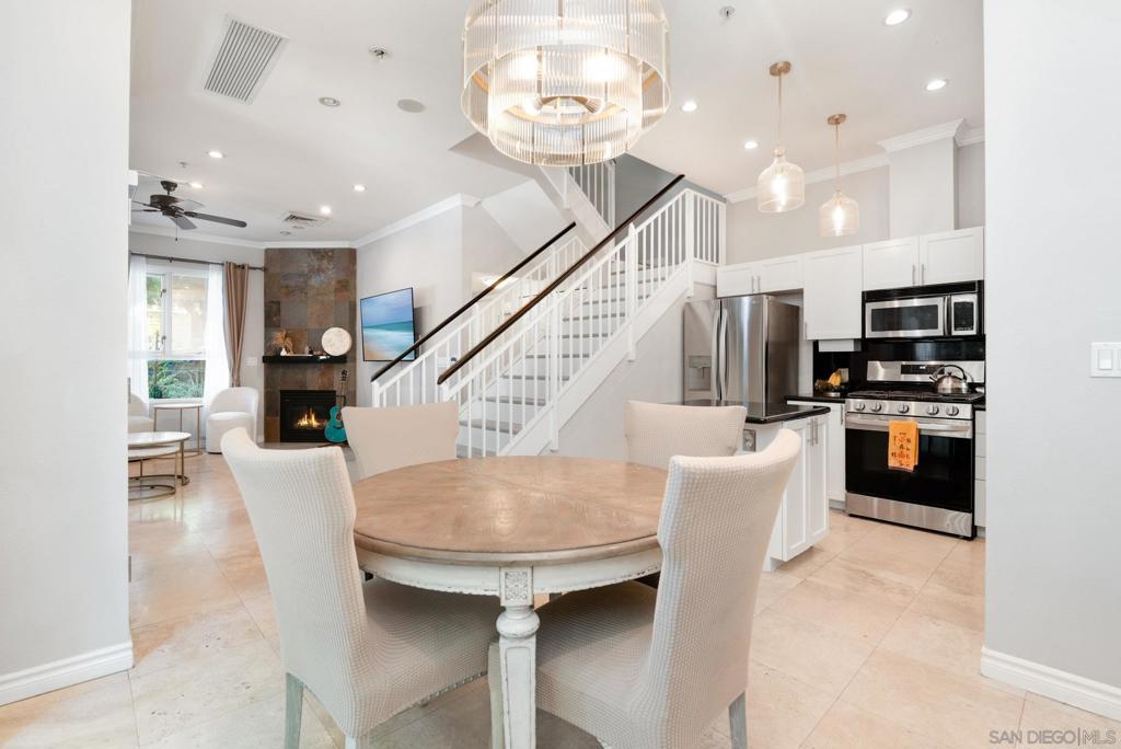 Discover this truly rare corner townhome unit in the sought-after Treo community! This private and rarely available corner unit offers convenience, privacy, and charm. With only one shared neighbor and extra windows throughout, this unit lives like a detached residence. Enjoy the ease of private walk-up access through your own street-level gated patio — perfect for pet owners and guests! Inside, soaring ceilings welcome you into a thoughtfully designed open floorplan. The main level features a modern kitchen with updated cabinetry, new stainless-steel appliances, fresh paint, stylish light fixtures, and a spacious island that flows into a dedicated dining area and private patio. The living room is warm and inviting with a cozy gas fireplace, there's a convenient half bath and plus ample under-staircase storage. Upstairs, you'll find two generously sized bedrooms with ceiling fans and each has its own en-suite bathroom, plus an in-unit stacked washer/dryer. The home includes one assigned parking space and a private storage unit, with easy access to rent a second parking space if needed. Treo residents enjoy an array of amenities including a pool, spa, fitness center, clubhouse, BBQ areas, and lushly landscaped courtyards. The community is pet-friendly with low HOA dues and an unbeatable walkable location. Located in the Columbia District, you’re just moments from the Trolley, Santa Fe Train Station, Seaport Village, Waterfront Park, and just steps from the vibrant neighborhood of Little Italy.