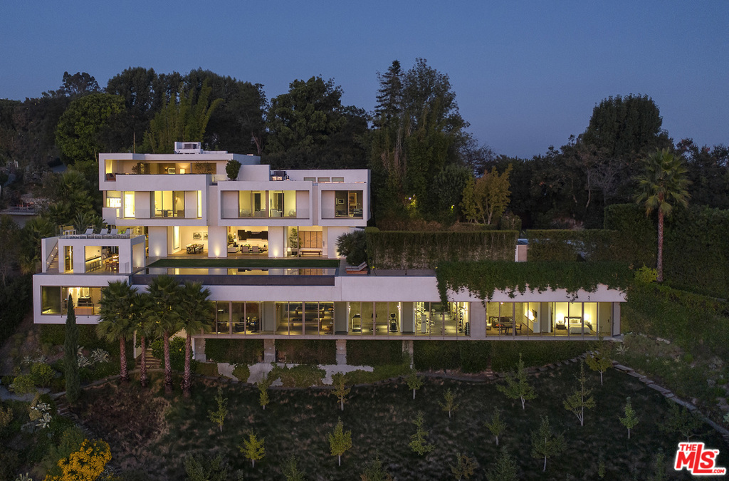 Bel-Air Iconic Architectural Statement by Mark Rios, FAIA, who designed an aprox 11,000sf residence epitomizing the LA lifestyle of indoor/outdoor living w/ city/ocean views. A 6bd, 8ba+ 3powder haven surrounded by gardens/pathways. Floor-to-ceiling glass doors open to a sun-filled LR to outdoor pool. Elegant FDR flows into swanky den. A chef's kitchen satisfies the discerning epicurean.Master suite w/ his/hers heated stone-floored bathrooms & walk-in wardrobes. 4 ensuite bds/office & manager's berth complete 2nd floor.Open floor plan captures views from every room. Modern design w/ elegant editing boasts luxurious stone, wood, bronze, glass & natural wall coverings/finishes. 21st Century lifestyle living: cabana, exterior bar/kitchen, sun deck, gym, spa/steam rm, office/study, library/lounge, 3rd fl screening room w/ rooftop terrace, Crestron, elevator, sep guest suite w/ game room, security office & motor court.A simple yet confident contemporary vision w/ subtle indulgences thruout