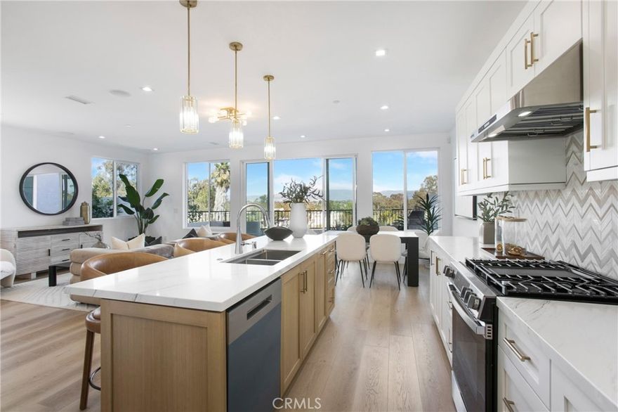 Exquisite Brand-New Contemporary Home in Laguna Niguel. Nestled at the end of a serene cul-de-sac, this corner-unit contemporary residence offers the perfect combination of modern design, luxury finishes, and smart-home technology. With 3 bedrooms, 3 bathrooms, and 1,975 sq. ft., this home is ideal for families, entertaining, and effortless Southern California living. Step inside to a bright, open-concept floor plan featuring soaring high ceilings and expansive windows that frame breathtaking city light views. Every detail has been thoughtfully designed — from the European cabinetry and white oak reeded interior doors to the custom wrought-iron staircase railing. The home's high-end finishes and designer touches create a harmonious blend of elegance and functionality. The gourmet kitchen is a centerpiece of the home, featuring European cabinetry, a wine captain, built-in appliances, and an open layout that flows seamlessly into the living and dining areas — perfect for hosting family and friends. This residence is fully prewired for home automation, including integrated surround sound, ceiling speakers, and ready-to-install TVs in every bedroom, making technology seamless and intuitive. Security and peace of mind are ensured with a Ring door camera and burglary alarm system, while a central vacuum system adds convenience to daily life. Each bathroom reflects modern luxury, with LED mirrors, sleek fixtures, and thoughtfully designed layouts. Closet organizers maximize storage while maintaining style and order.  Outdoor living is equally impressive, featuring a built-in BBQ and gas firepit, perfect for entertaining or relaxing under the California sky. The expanded two-car garage and ample guest parking complete this property, ensuring both functionality and comfort.  This home is more than just a residence — it is a masterpiece of contemporary design, offering modern technology, premium finishes, and a lifestyle of ease and sophistication. Rarely does a newly constructed smart home of this caliber become available in Laguna Niguel, making this an extraordinary opportunity for discerning buyers.