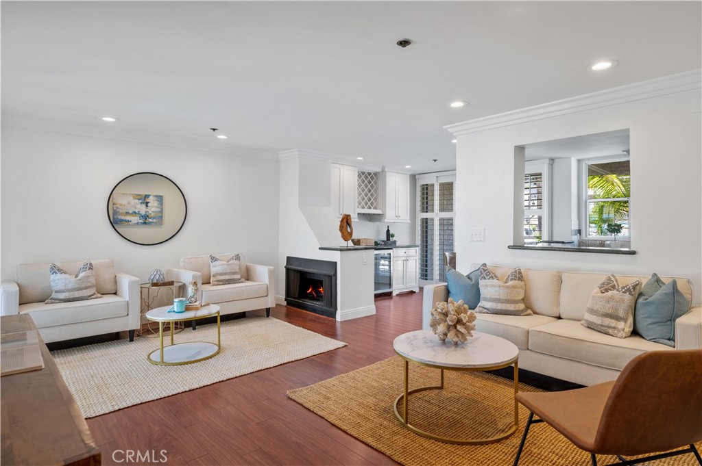 Experience oceanfront living in this beautifully updated single-level condo, perfectly positioned on The Esplanade with breathtaking coastline views from Palos Verdes to Malibu. Two patios—including a west-facing deck—set the scene for your morning coffee or sunset glass of wine overlooking the Pacific.
Step inside to a bright, open floor plan where wide-plank floors, plantation shutters, recessed lighting, and fresh coastal tones create an inviting, airy feel. The living room, complete with a cozy gas fireplace, opens directly to the deck and offers partial ocean views. The remodeled kitchen is thoughtfully designed with stone countertops, white cabinetry, a tile backsplash, and stainless steel appliances. The dining area features built-ins, a buffet, and a wine fridge—perfect for easy entertaining.
The spacious primary suite offers dual closets and an ensuite bath, while the secondary bedroom is filled with natural light and access to the second bathroom. Additional highlights include ample closet space, in-unit laundry, and beautiful floors throughout in the main areas with plush carpet in the bedrooms.
This secure building offers two side-by-side parking spaces, bike storage, a community terrace overlooking the ocean, and direct, secured access to the beach.
All of this and only steps to the beach, the Redondo Beach Farmers Market, the Pier, parks, restaurants, shops and Riviera Village.
To live, live by the sea!
