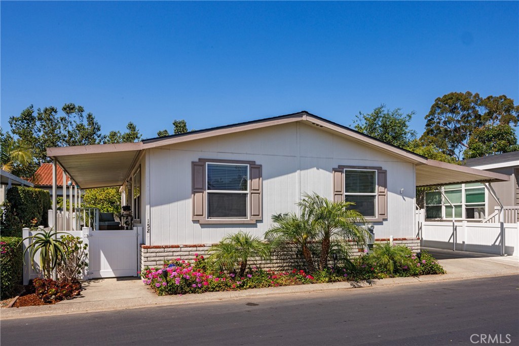 Welcome to your new home! This well-maintained 3-bedroom, 2-bathroom mobile home offers 1,414 sq ft of comfortable living in the heart of San Juan Capistrano. Packed with upgrades, the home features a newly remodeled kitchen with high-end stone countertops, a center island, soft-close drawers, and a walk-in pantry. Both bathrooms have upgraded vanities, and one includes a freestanding bathtub with a floor-mounted tub filler and hand shower. Enjoy year-round comfort with a new air conditioning unit and a new water heater. The entire home has been re-piped with Pex piping and also comes with a brand-new roof. Step outside to a large, private backyard that’s fully landscaped and enclosed with white vinyl fencing—perfect for relaxing or entertaining. Parking won’t be an issue, as the extended driveway accommodates up to three cars, complete with awning extender posts. This home is inside San Juan Mobile Estates, a rent-controlled community with a low monthly space rent of just $1,092. Location is key, and this property puts you close to River Street Marketplace, Los Rios Historic District, and the iconic Mission San Juan Capistrano. If you’re looking for a day at the beach or to enjoy the marina, Doheny State Beach and Dana Point Harbor are only a short drive away. This move-in-ready home offers both convenience and comfort. Don’t miss your chance to live in this great community!