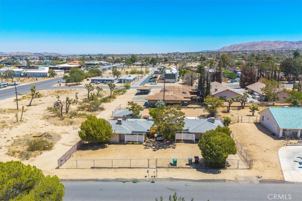 Pride of Ownership – Two Turn-Key Homes on One Lot | Detached Garage. Don't miss this unique opportunity! Situated on a spacious .35-acre lot, this property features two well-maintained 2-bedroom, 1-bath homes with a combined 1,484 sq ft of living space. Perfect for multi-generational living, rental income, or live in one and rent the other. Each home shows true pride of ownership with clean, functional layouts and turn-key condition. The property is fully fenced, offering privacy and security, and includes a detached garage for additional storage or parking. Conveniently located close to shopping centers, restaurants, and town, this property combines comfort, value, and versatility. Whether you're looking for a primary residence with rental income or a ready-to-go investment, this one checks all the boxes. Schedule your showing today!