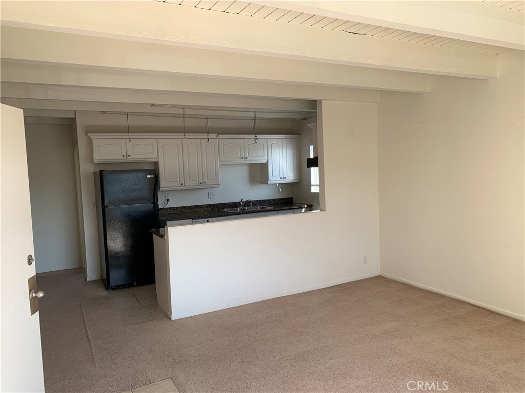 Walk to the beach! Awesome one bedroom one bathroom second floor unit in beautiful Dana Point! Very spacious unit, beamed ceilings, LVP floors throughout, fresh paint, and tons of natural light! Community laundry, one car garage. No smoking, one pet allowed, no insurance restricted breeds, 40 pound maximum size. Great location near shopping, dining and freeway.