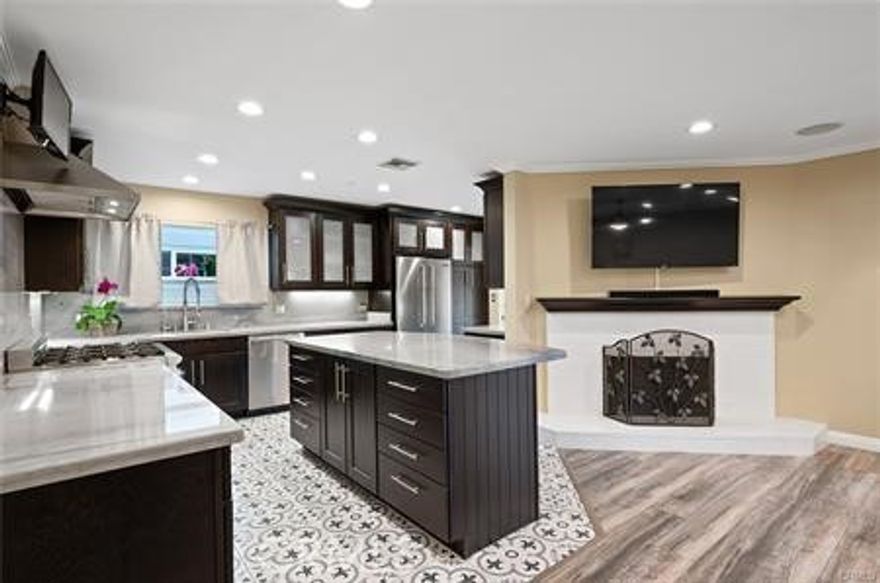 REDUCED BY $75,000 FOR A QUICK DEAL.  Beautifully updated single-story home in prime West Hills featuring 3 bedrooms, 2 bathrooms, and 1,570 sq ft of living space on a 7,595 sq ft lot. Highlights include a remodeled kitchen with Thermador appliances, marble countertops, and an oversized island; open living and dining areas; dual-pane windows; new roof; new central HVAC; tankless water heater; and new sewer line. The primary suite offers an upgraded bath, and both bathrooms have been remodeled. The private backyard includes a heated pool, covered patio, and landscaped yard. Attached two-car garage with direct access. Conveniently located near parks, shopping, and top-rated schools.