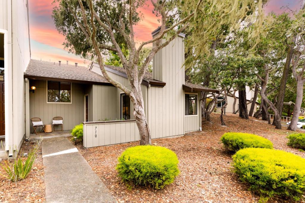 Welcome to your chance to own a spacious single-story condo in the heart of Pacific Grove, also known as Butterfly Town, USA. This 2-bedroom, 2-bathroom corner unit offers approximately 1,135 square feet of light-filled living space in one of the areas most charming communities - Forest Grove. The interior is original but well maintained, offering a move-in-ready space you can make your own. The unit features a comfortable primary bedroom and a second bedroom, along with two full bathrooms. Highlights include a cozy gas-burning fireplace, indoor laundry, and a detached 2-car garage with a brand-new door and motor. Expansive windows fill the home with natural light, and the private, fenced patio is surrounded by lush greenery. Enjoy access to community amenities including a clubhouse, and if you have a furry companion, you're in luck the HOA allows two pets! You'll love the peaceful setting, where friendly deer often roam, adding to the natural charm. Plus, you're just a short walk to Rip Van Winkle Park and all the coastal beauty Pacific Grove has to offer. With a monthly HOA of $626, this is a rare opportunity to get into one of the Monterey Peninsulas most sought-after communities at a great price. Don't miss your chance -opportunities like this don't come often!