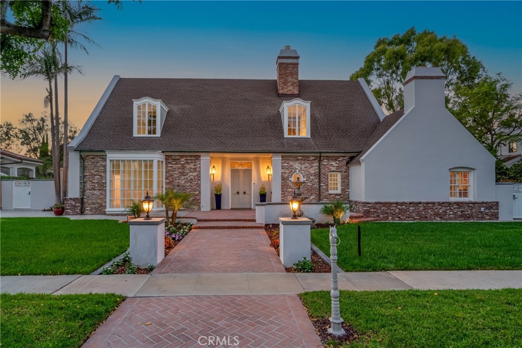 Welcome to one of Virginia Country Club’s finest homes, nestled on the serene interior block of Cedar Avenue. This stunning single-level residence, designed by renowned architect Kenneth Wing, offers an impressive 4,283 square feet of living space on approximately 14,827 square feet of beautifully landscaped grounds. Recently renovated with exquisite attention to detail, this home is move-in ready and waiting for its next fortunate owners. Step through the oversized front door into a graceful circular foyer that opens to the main living areas. The expansive formal living room features a cozy fireplace and picturesque views of the rear grounds, creating an inviting space for relaxation or entertaining. Adjacent is the elegant formal dining room, complete with built-in cabinetry, perfect for hosting memorable dinners. The spacious great room is highlighted by a second fireplace and a stylish wet bar, ideal for casual gatherings. The chef’s kitchen is a culinary dream, equipped with brand-new Thermador appliances and ample counter space for all your cooking needs. Just off the kitchen, you’ll find a convenient mudroom and laundry area, plus an additional washer and dryer located in the luxurious primary suite. The primary suite is a private retreat featuring a fireplace, French doors that open to the serene backyard, a separate dressing area, a soaking tub, and a large curbless shower. Two additional main house bedrooms each offer en suite bathrooms for comfort and privacy. A detached casita serves as a versatile fourth bedroom with a private bath, custom cabinetry, and a Murphy bed—perfect for guests. The oversized three-car garage is fully insulated and includes a built-in air compressor and a bonus storage loft of approximately 500 square feet. Additional highlights include a walk-down basement with an 8x12 cement shelter, approximately 1,400 square feet of full-height attic space (not included in the total square footage) with potential for expansion, new HVAC systems, tankless water heaters, updated water lines, and convenient RV parking. Experience the perfect blend of timeless design, modern upgrades, and exceptional functionality in this remarkable Virginia Country Club home.