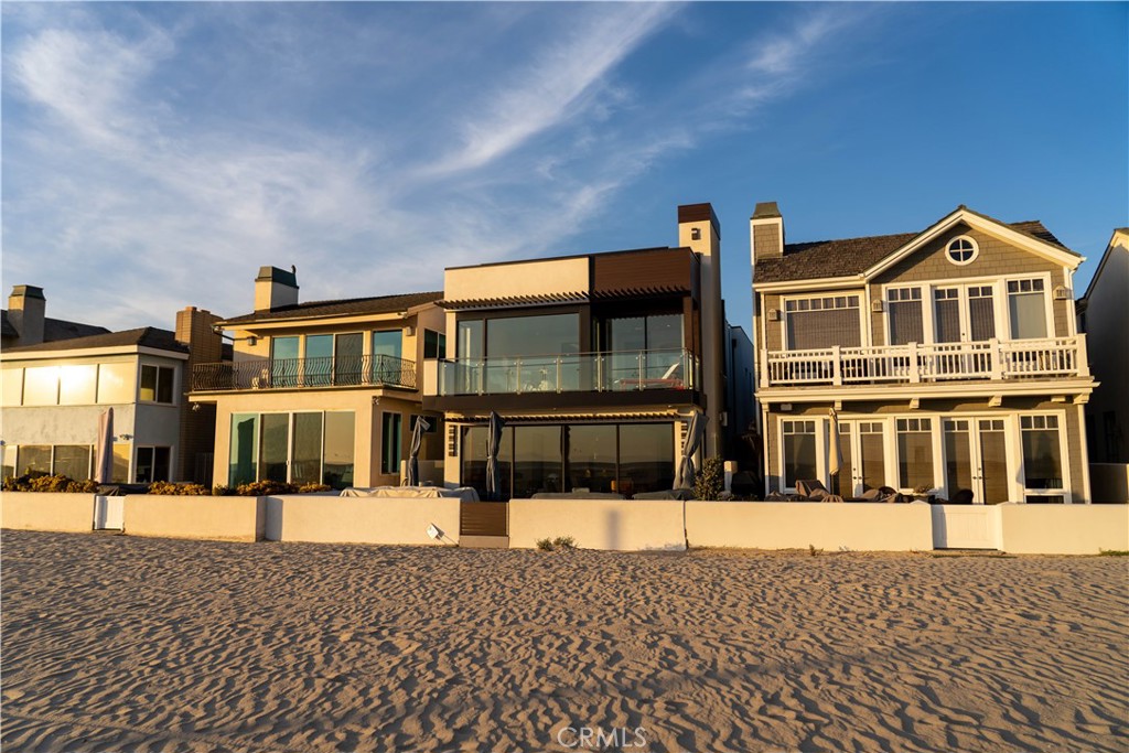 Welcome to coastal luxury redefined. Perfectly positioned directly on the sand in Newport Beach, this completely remodeled modern masterpiece offers the ultimate oceanfront lifestyle. With 3 spacious bedrooms, 3.5 designer bathrooms, and a sleek contemporary design throughout, this stunning two-story home is the epitome of Southern California elegance and comfort. Step inside and be captivated by panoramic ocean views, high-end finishes, and an open-concept layout that blurs the line between indoor and outdoor living. The gourmet kitchen features top-of-the-line appliances, custom cabinetry, and an oversized island perfect for entertaining. The living area opens seamlessly to the beachside patio—ideal for morning coffee, sunset cocktails, or simply soaking in the sound of the waves. Upstairs, retreat to the luxe primary suite with its own private balcony overlooking the Pacific, spa-inspired ensuite bath, and generous closet space. The additional bedrooms offer comfort and privacy for family or guests, each with their own en-suite bathrooms. But the crown jewel? A private rooftop deck with 360-degree views from the coastline to the city lights—your own exclusive oasis for entertaining, sunbathing, or star-gazing. Located just steps from world-class dining, shopping, and the Newport Harbor, this is a rare opportunity to lease one of the most coveted addresses on the beach. Live where others vacation. Welcome to 7104 W Oceanfront.
