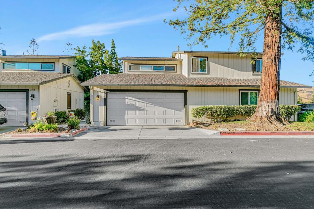 Welcome to 7378 Tulare Hill Drive, San Jose. Located in the desirable Tulare Hill Townhomes, this bright and spacious 2-bedroom, 2.5-bath home with an office nook offers vaulted ceilings, hardwood floors, and abundant natural light. Enjoy an open floor plan with a cozy gas fireplace, private deck, and modern kitchen featuring granite countertops, stainless steel appliances, and LED lighting. Additional highlights include double-pane windows, central A/C and heating, fresh paint, laundry hookups, and an attached 2-car garage. Close to scenic foothills and walking trails. This move-in-ready home has it all!