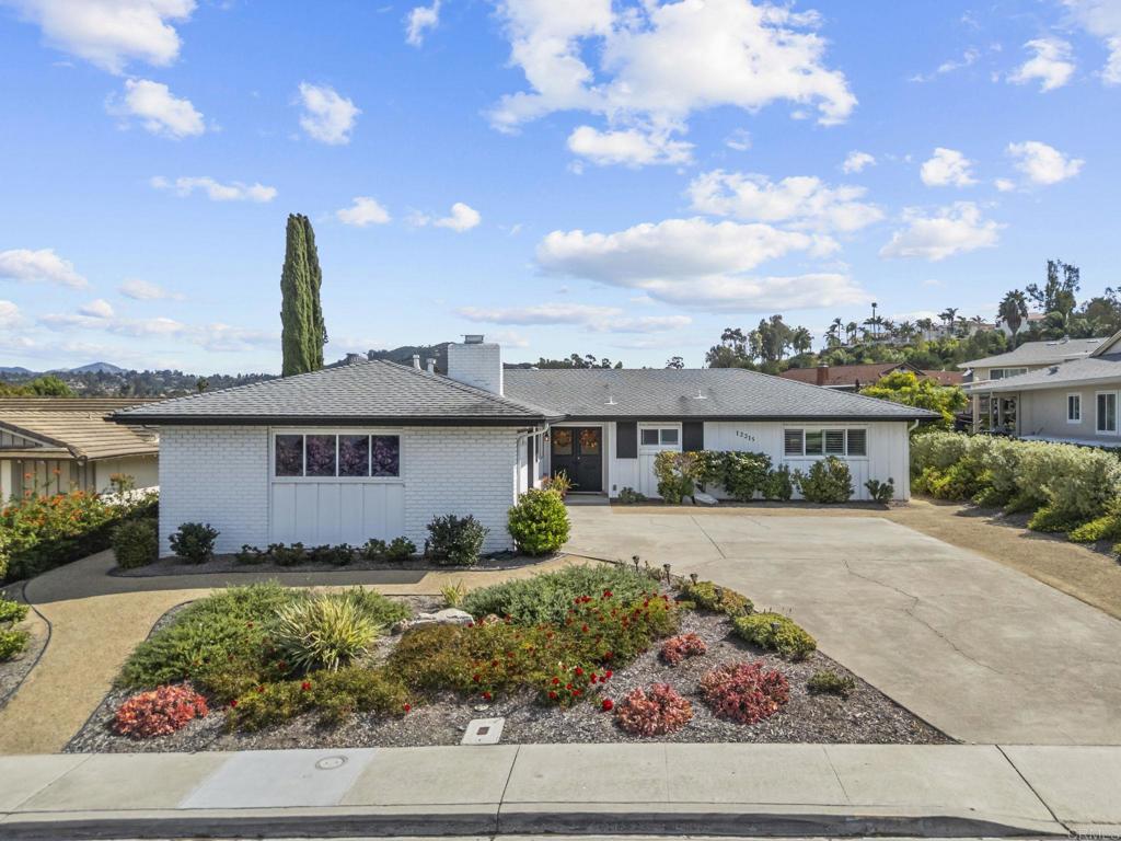 Exceptional single-story home on a spacious and private ¼-acre lot in the peaceful 55+ community of Seven Oaks in Rancho Bernardo. Thoughtfully renovated inside and out with quality upgrades and modern comfort in mind. The inviting interior features new light-toned luxury vinyl plank flooring, energy-efficient dual-pane windows, custom window coverings, and fresh interior and exterior paint. The beautifully remodeled kitchen offers soft-close cabinetry with pull-out storage, quartz countertops, tile backsplash, and stainless steel appliances. Both bathrooms have been tastefully updated with stylish finishes. Major system upgrades include a new HVAC, new gutters, new drainage and irrigation systems, plus drought-tolerant landscaping for easy maintenance. The enclosed sunroom adds flexible living space ideal for a home office, hobby room, or relaxing retreat overlooking the serene backyard. Outdoor space features mature landscaping and patios for year-round enjoyment. Seven Oaks residents enjoy access to a community center with pool, spa, fitness, pickleball, hobby studios, social clubs, and nearby Oaks North Golf Course. Convenient to shopping, restaurants, medical services, and freeway access. Move-in ready and beautifully maintained.