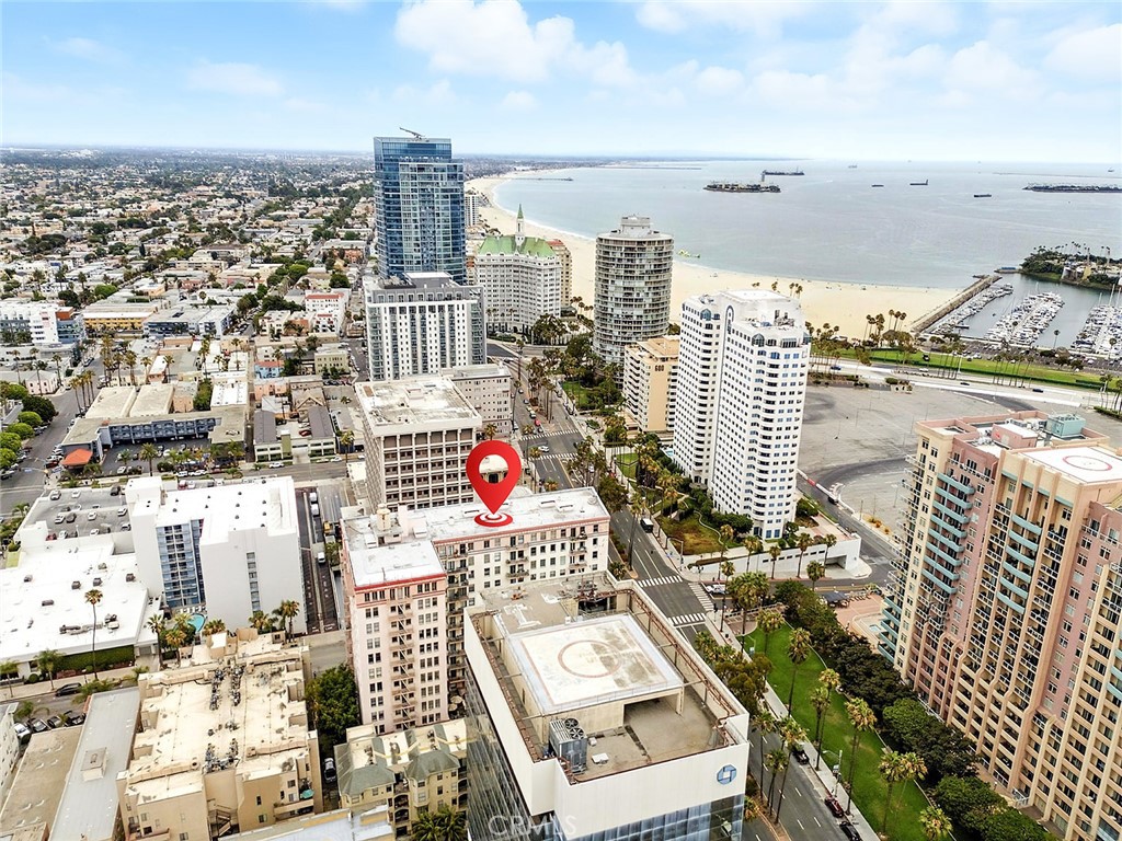 Ocean View corner unit in the Historic 1923 Cooper Arms. This light filled approx. 1000 sq ft one bedroom unit offers sweeping ocean views. Located just steps from the Pacific, this historic Deco gem features stunning parquet floors, high ceilings, and an abundance of natural light. Timeless character of oversized mahogany closet doors and spacious bedroom, all offering generous storage. Additional bedroom/office space too, make it perfect for working at home or out of town visitors. Updated kitchen and bathroom. With vintage details and a premier coastal location, this is Long Beach living at it's finest.