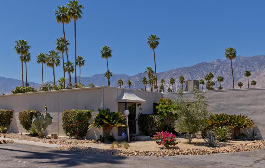 This thoughtfully updated mid-century residence in Garden Villas East was designed by Sherwin L. Barton in 1966. Renovated in 2021 with quartz countertops, stainless-steel appliances, stylish tilework, and a refined mid-century palette. A new HVAC system was added in 2023, and in 2025 the interior--including ceilings--was freshly repainted and all windows and sliding doors replaced with energy-efficient dual-pane vinyl units. The community is also upgrading systems to support solar power. Lush landscaping, two pools, and covered parking next to the unit complete this prime South Palm Springs location.