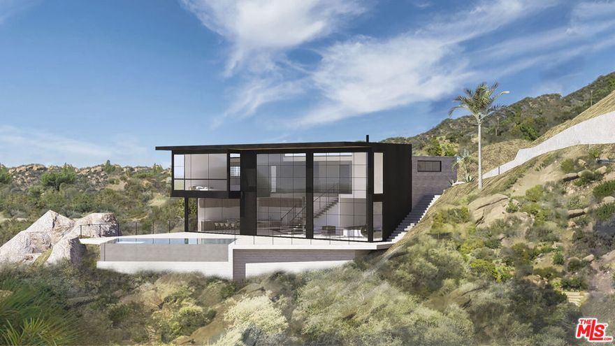 EXPERIENCE A MALIBU SANCTUARY WITH DRAMATIC VIEWS FROM CANYON TO COASTLINE. Step onto nearly 3 acres where canyon ridgelines sweep toward Point Dume and the Pacific Ocean in the distance. The setting is cinematic, with almost two usable acres offering the space and privacy to build a true Malibu estate. Coastal Commission approved plans by renowned architect Vitus Matare call for a 4,600 sq. ft., two-level residence that frames the views from every angle. Expansive terraces, a pool, and seamless indoor-outdoor living were all envisioned to capture the rhythm of the ocean and the beauty of the surrounding hills. Much of the groundwork is already complete: grading permits are finalized, the driveway and retaining walls are finished, and an 8-inch water main is installed. With paved access and electricity at the lot line, you're ready to move straight into building your dream. What makes this property exceptional is the rare pairing of usable land, extraordinary views, and completed approvals. It's an opportunity to create a home that blends luxury, nature and timeless Malibu living.