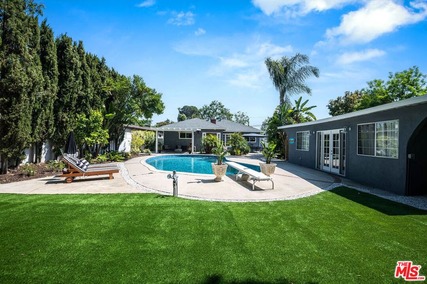 Stunning oasis located in the coveted Beeman Park neighborhood. Covered in mature Ficus trees, this resort style home sits on over 10,000 square feet and boasts a yard and entertaining space rarely seen in prime Studio City. Reimagined with the idea of connecting the indoor and outdoor with its open layout and flow, this is truly California living. This thoughtfully remodeled and expanded home features 3 beds, 3 baths and is adorned with a detached structure with bathroom , perfect for a gym or home office!. Hardwood floors, built in cabinetry, a custom breakfast nook, quartzite countertops, integrated sound system, electric car charger, new turf and pool resurfacing are just a few of the upgrades made. Located moments from Sportsmans Lodge, Beeman Park, Whole Foods, Hugo's, Ventura Blvd, Wedding Golf & Tennis & all the best in Studio City.