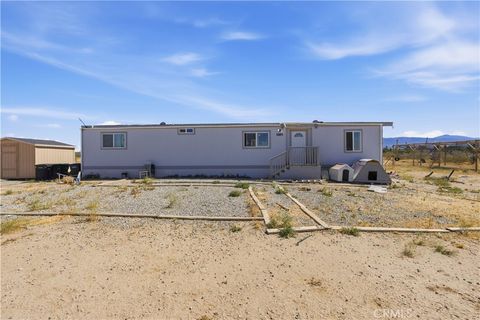 Photo of 5885 Dos Palmas RD, Phelan, CA 92371 (MLS # HD26111653)