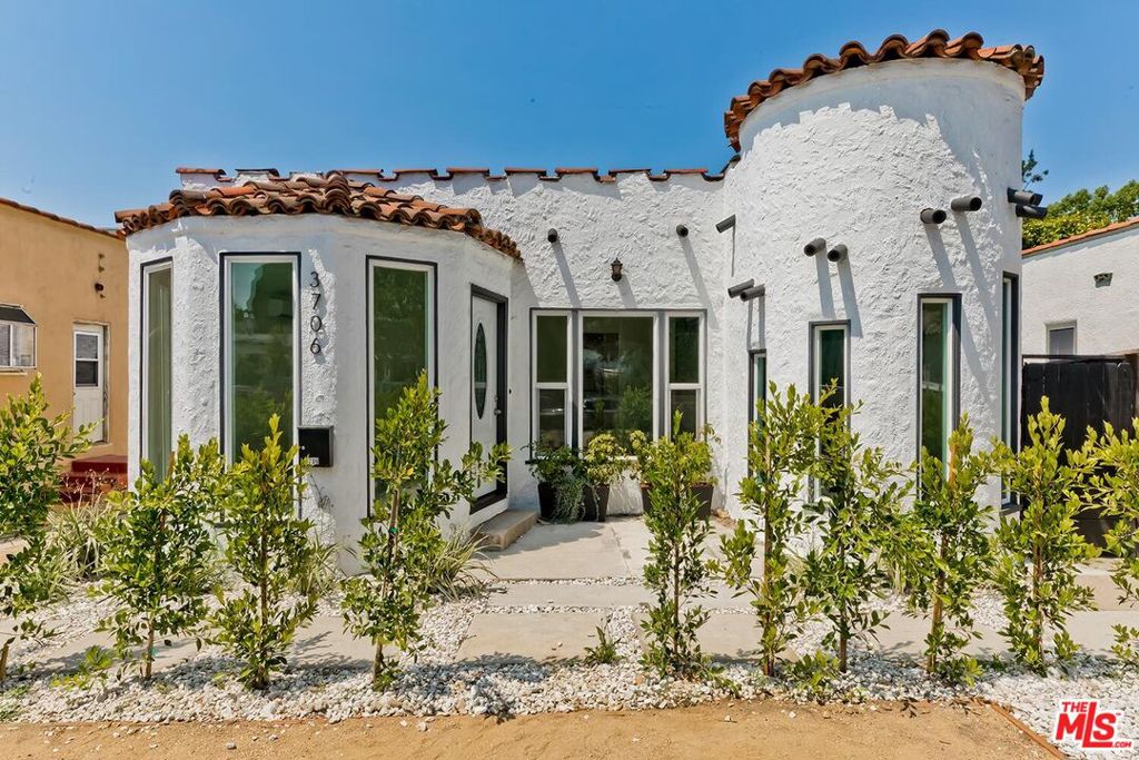 This Atwater home is a Spanish-style gem, ideally located just a two-minute walk to Glendale Blvd, offering a blend of historic authenticity and modern updates. This beautifully remodeled two-bedroom, one-bathroom home features tranquil living spaces with a contemporary twist. The kitchen is equipped with stainless steel appliances, custom cabinetry, and abundant natural light. The private rear patio is ideal for al fresco dining and relaxing. Additional updates include fresh paint, brand-new mini-split AC units, tasteful landscaping, and a fully remodeled bathroom. This charming home is a must-see!
