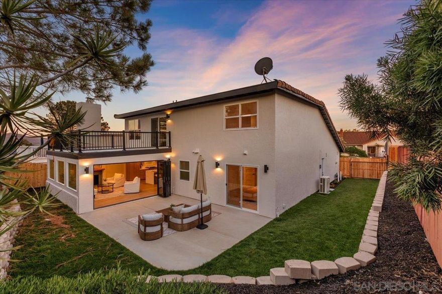 Don’t miss this exceptional coastal residence located in the highly desirable Village Park community. This fully remodeled four-bedroom, four-bathroom home showcases modern luxury and thoughtful design throughout, situated on a generous 6,000 sq. ft. lot.  Upon entry, you are welcomed by vaulted ceilings and abundant natural light that enhance the open and spacious living area. The gourmet kitchen features waterfall-edge quartz countertops, custom light oak cabinetry, a designer quartz backsplash, and top-of-the-line stainless steel appliances. A large center island with integrated seating and elegant pendant lighting provides the perfect space for everyday dining or entertaining.  Expansive 12-foot cantina-style sliding glass doors create a seamless connection between indoor and outdoor living, opening to a beautifully landscaped backyard ideal for relaxation or gatherings. Wide-plank luxury vinyl flooring and a neutral color palette lend a sophisticated, contemporary ambiance throughout the home.  The flexible floor plan includes primary suites on both the main and upper levels, offering convenience and privacy. Each bathroom has been meticulously updated with custom vanities, designer finishes, and premium fixtures.  Located on a quiet street just minutes from award-winning schools, pristine beaches, local parks, shopping, and top-rated dining, this turnkey home offers the perfect combination of style, comfort, and location.