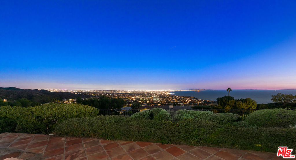 Impressive 16,700 SF+/- bluff top property located in the prestigious Pacific Palisades offers breathtaking 270-degree views of the ever-changing skyline with picturesque sunrises, sunsets and evening shimmering city lights. Views span across the Pacific Ocean to Catalina Island, down the coastline to Palos Verdes Estates and across the city to downtown LA. The property comes permit ready for a warm, mid-century inspired 8,000SF+/- new home. The contemporary design is fit for a modern family with four bedrooms on the primary floor, formal living room, captivating interior courtyard, office and a sunken outdoor BBQ area. The lower level is designed to accommodate a fifth bedroom-suite, gym, media area and wine room. Customize with your own design finishes and personal touch. Ready to enjoy in approximately 24 months. Prime location, minutes to Palisades Village and the beach. Existing 2,275SF+/- 3bed / 3bath residence on property.
