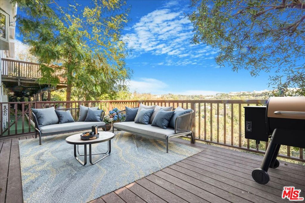 Discover the charm of this unique hillside property, tucked away on a shared lot with a larger home. Offering its own private entrance, this residence ensures both privacy and flexibility. This rare lease blends privacy, awe-inspiring scenery and affordability in one of Brentwood Hills' most coveted locations. Enjoy an open, light-filled floor plan designed for seamless living and entertaining. Expansive windows and sliding glass doors open onto a large deck, showcasing breathtaking panoramic views of the Getty Museum. The bedroom has a large walk-in closet has rich wood flooring. The stylish bathroom boasts Calacatta-style marble and a sleek, glass-enclosed shower. A fully updated kitchen with new appliances and an in-unit washer and dryer enhances everyday convenience. The open dining and living area flows seamlessly to an oversized private deck with stunning Getty viewsyour perfect retreat. No sign is posted at the property.