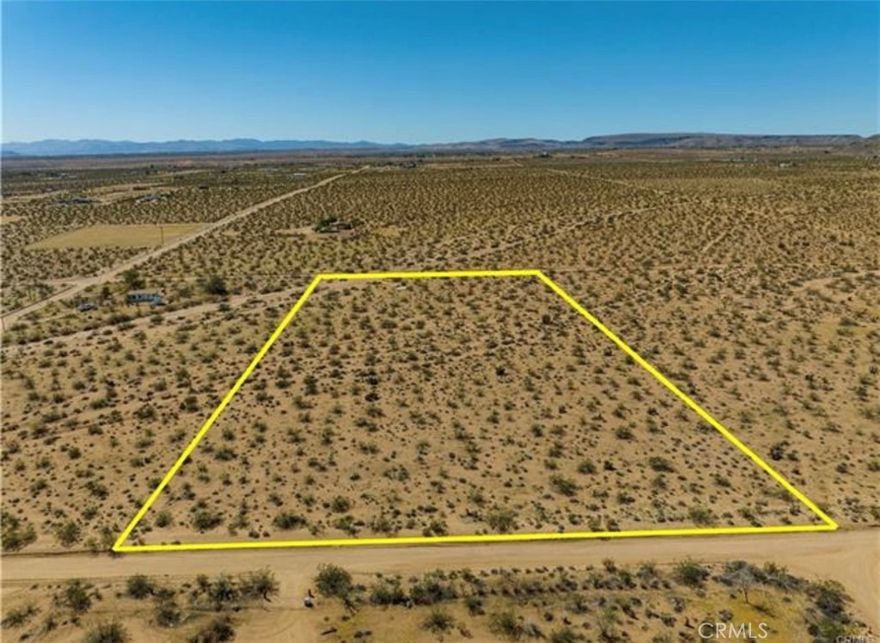 5 Acres of Untapped Desert Potential – Power & Water at the Street! Discover the freedom and opportunity of owning five expansive desert acres—a blank canvas ready for your vision. Whether you're dreaming of building a custom home, launching a unique retreat, or investing in land with future potential, this lot offers a rare mix of seclusion and accessibility. With water and power conveniently available at the street, your path to development is streamlined from the start. The location offers the kind of privacy only the desert can deliver, while still being just minutes from local favorites like LA Copine, Giant Rock Meeting Room, and nearby gas stations and convenience stores.And for the adventurers—Giant Rock and its surrounding wilderness are only 10 minutes away, inviting you to explore, hike, and disconnect in one of the desert's most iconic landscapes. A fictitious address has been used for easier GPS navigation. Lot lines are approximate; buyers to verify all utilities and boundaries during due diligence. Your desert dream starts here.