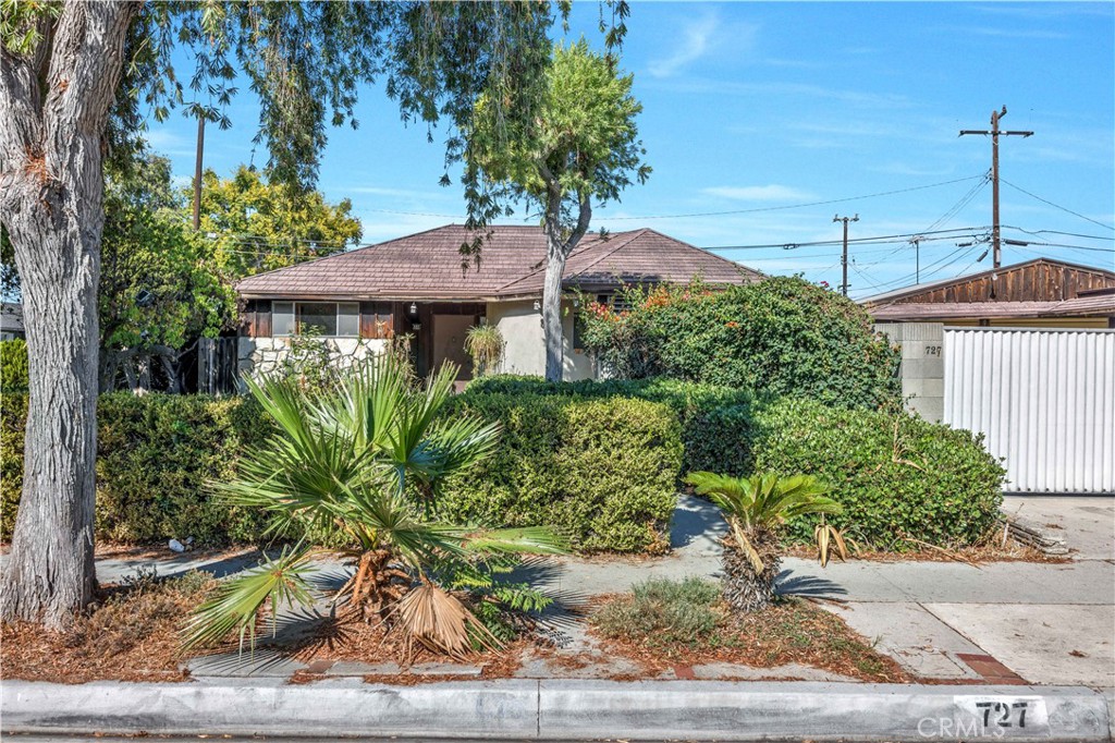 Diamond int he Rough! A home full of possibilities. Located in one of Anaheim's popular neighborhoods. A gem of opportunity for those who love a HUGE LOT (9,000 sq ft) and are a visionary of potentials. Needs TLC but has a great footprint to design your space. 3 bedrooms, 2 baths, single story, corner lot, with a huge living room, ample size bedrooms, and one of a kind detached garage that could be transformed into a wide range of useful spaces, depending on your needs. Bring your paint, brush, vision and build this home into one extraordinary oasis. Do not miss out on this opportunity. Sold in as-is condition. Definitely, a MUST see!