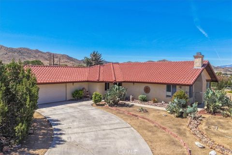 Photo of 8802 Rubidoux Avenue, Yucca Valley, CA 92284 (MLS # JT26075633)