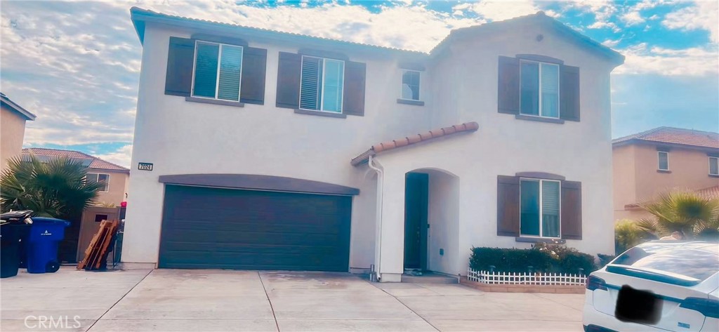 NO HOA. PAID SOLAR. UPGRADED FRONT YARD. EXPANSIVE BACK YARD. GOOD CONDITION. Welcome to this beautiful 5-bedroom, 3-bathroom home built in 2020 with nearly 3,000 sq. ft. of living space. Meticulously maintained, this home feels like new and comes with fully paid-off solar panels for energy efficiency and savings. The spacious 7,400+ sq. ft. lot features a front yard upgraded with over 10k in custom concrete work, creating low-maintenance curb appeal. The expansive backyard is both wide and deep, offering endless possibilities—from a safe play area with a built-in slide for kids, to the perfect setting for entertaining, gardening, or even building your dream pool. Inside, you’ll find an open floor plan with abundant natural light, a modern kitchen, and a convenient downstairs bedroom and bath for guests or multi-generational living. With no HOA, low property taxes, and a prime location near supermarkets, restaurants, and major freeways, this home blends comfort, convenience, and lifestyle.
