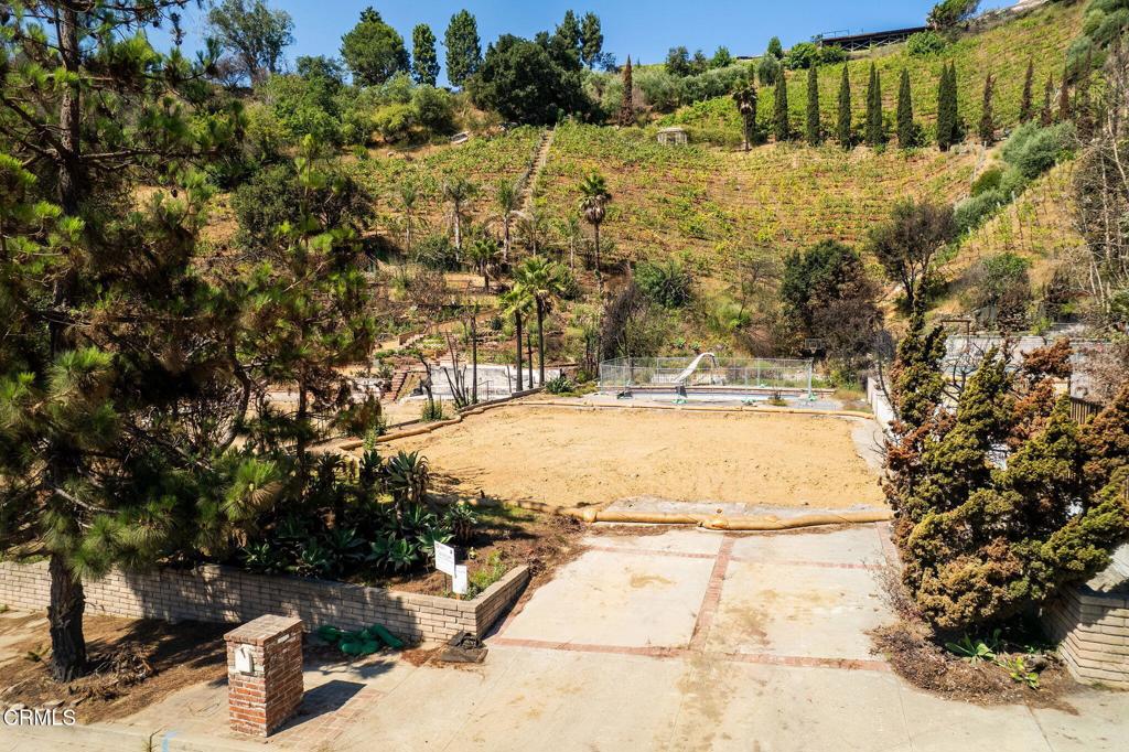 One of the best buildable lots in Pacific Palisades. Welcome to 1227 Bienveneda Avenue, a rare and extraordinary offering in the heart of the Pacific Palisades. This nearly 15,000-square-foot parcel of mostly flat land sits in the serene and sought-after Upper Bienveneda neighborhood that remains largely intact. You won't be surrounded by construction for the next several years. Formerly home to 4 bedroom 2 bath residence that was approximately 2,000 sqft. Phase 2 Debris Removal has been completed, saving you both time and cost on your new build. A well-positioned pool remains towards the rear of the property. The lot is shovel-ready and brimming with possibility. Whether you envision a stunning modern estate, a timeless traditional, or a peaceful retreat surrounded by canyon breezes and coastal skies, this blank canvas is ready for your imagination to take over. Opportunities like this are rare--don't miss your chance to build your dream home in one of Los Angeles' most coveted coastal communities.