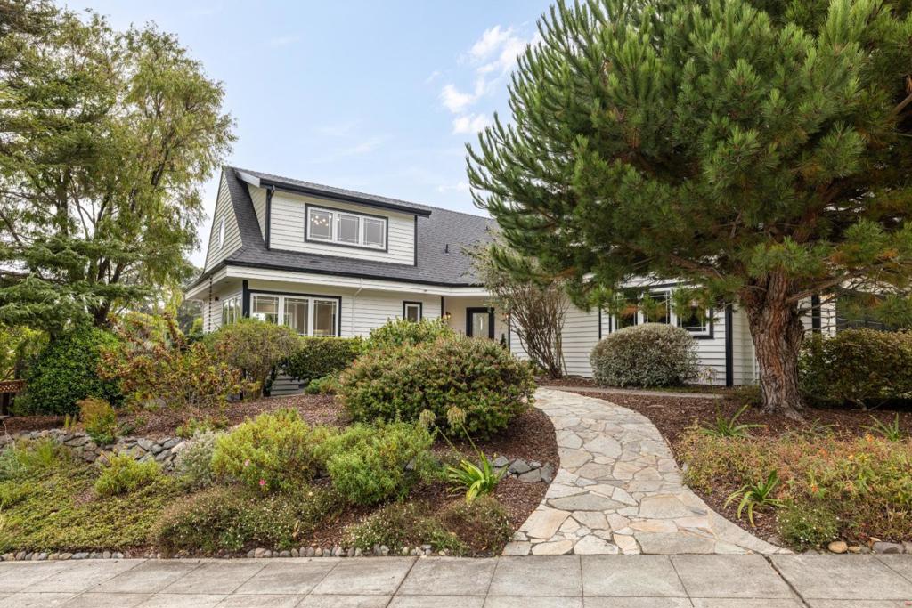 This expansive home boasts 5 bedrooms and 3.5 bathrooms across an impressive 2,836 square feet living space on a generous 10,019 square foot lot. As you enter this beautiful residence, you're greeted by an open floor plan that effortlessly blends comfort and elegance. The interior is awash with natural light thanks to numerous sky lights and large windows that offer breathtaking ocean views, pastoral scenes and rolling hill views. The hardwood floors add warmth throughout the home while high ceilings contribute to an atmosphere of spaciousness and luxury. The primary suite has expansive views of the pastures and mountains and comes complete with double cedar lined closets providing ample storage space. Two additional rooms on the main floor can function as either a fifth bedroom suite for live in parents, an adult child or guests. The kitchen flows seamlessly into the dining and living areas, creating an inviting space for entertaining or relaxing, including more stunning views of the pasture across the street. Outdoors features include a spa - perfect for unwinding after a long day along with a refreshed chicken coop and garden shed complete with electrical, adding charm and functionality to this unique property.