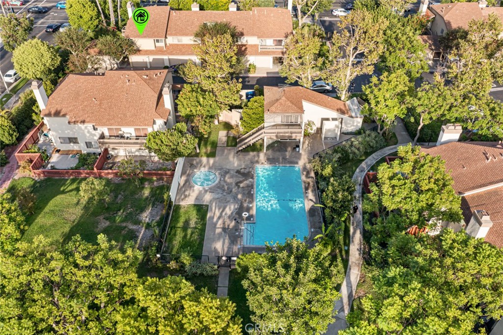 Tucked away in a gated community, this charming end-unit condominium is the perfect place to call home. With 2 bedrooms, 1.25 bathrooms, and a private balcony, it offers both comfort and convenience for everyday living. Step inside to find soaring vaulted ceilings, a recently remodeled kitchen with quartz countertops, modern cabinetry, and stainless steel appliances. The main bathroom has been tastefully updated, including a sleek tub/shower stall. The cozy fireplace and central A/C make the living space perfect year-round. This unit also offers plenty of parking options with 2 detached single car garages plus an additional pad for a third vehicle, along with in-unit washer/dryer hookups. All appliances are included, making this a true move-in ready home.
Located in a gated community, residents enjoy access to a sparkling pool, jacuzzi, and well-maintained grounds. The prime location offers quick access to the 22 freeway, top restaurants, parks, schools, and is just 20 minutes from the beach, Disneyland, local airports, and plenty of shopping options at South Coast Plaza mall. This Santa Ana gem has it all—style, space, and convenience. Don’t miss the opportunity to make it yours!