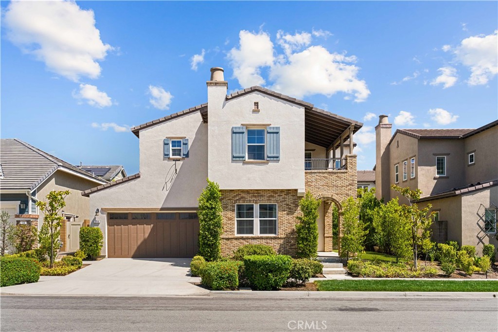 Welcome to 106 Trowel, Irvine — a beautifully appointed 4-bedroom, 4-bathroom residence nestled in the highly sought-after Great Park community. Ideally located on a quiet street, this home offers a well-designed layout featuring a convenient main-floor bedroom and full bath, perfect for guests or multi-generational living. The open-concept living space showcases soaring 10-foot ceilings, a gourmet kitchen with a walk-in pantry, and a flexible bonus area ideal for a home office or study nook. The elegant primary suite boasts a spacious walk-in closet, separate shower, and relaxing soaking tub. Generously sized secondary bedrooms provide plenty of space for all. Enjoy California living in the expansive backyard with a covered patio, lush landscaping, and mature vegetation — perfect for entertaining or quiet retreat. Located near top-rated Irvine schools and offering access to premier HOA amenities including pools, parks, a clubhouse, dog park, and hiking trails. This home offers the perfect blend of comfort, convenience, and community.