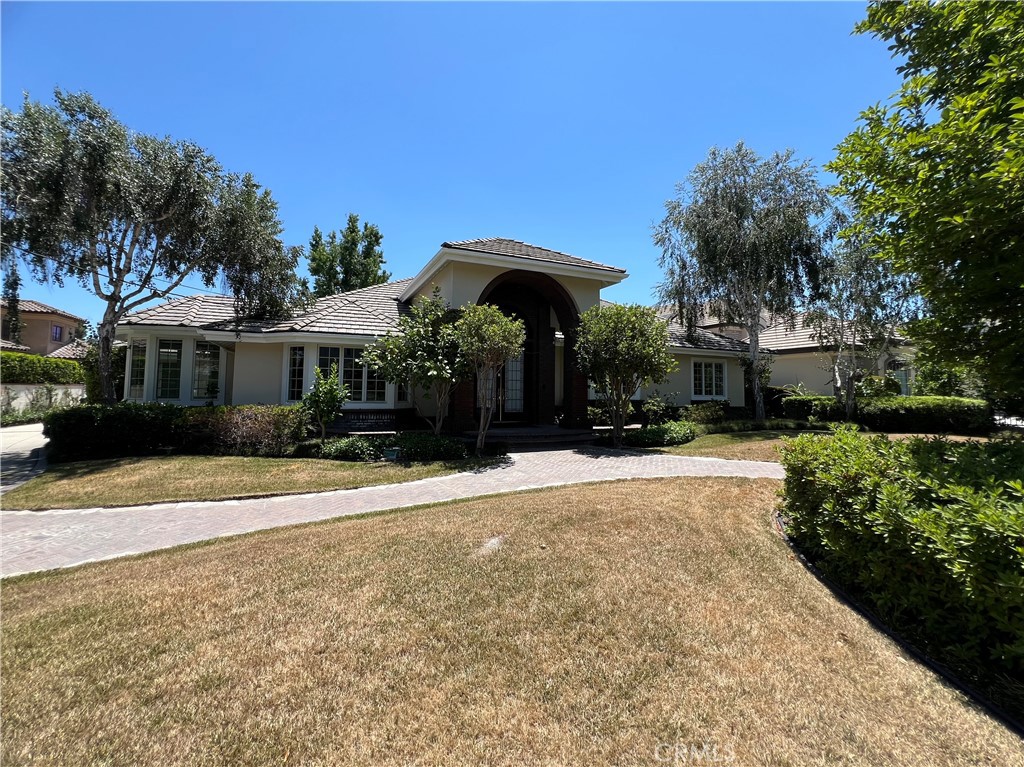 Welcome to this meticulously remodeled, move-in ready single-level Arcadia estate, a rare rental opportunity seamlessly blending timeless elegance with modern comfort. Originally rebuilt in 1995 and recently upgraded with new wide-plank luxury flooring, fresh interior and exterior paint, refinished cabinetry, and beautifully renovated spa-inspired bathrooms, this 4,485 sq. ft. residence is set on a lush 18,201 sq. ft. lot in one of Arcadia’s most prestigious neighborhoods, offering both privacy and prestige.
The open, airy floor plan features soaring ceilings, bespoke finishes, and expansive formal living and dining rooms. The gourmet kitchen boasts granite countertops, stainless steel appliances, a large center island, and custom cabinetry, ideal for both everyday living and hosting elegant gatherings. Just off the kitchen, a sophisticated bar area with granite counters, bar sink, abundant storage, and a professional-grade beer tap creates the perfect setting for entertaining. The serene primary suite offers a spa-like retreat with a soaking tub, walk-in shower, and dual vanities.
Step outside to your private resort-style backyard, featuring a lagoon-inspired pool with natural rock accents, water features, and mature landscaping for ultimate seclusion. A detached 3-car garage and extended driveway provide ample parking. Perfectly situated just minutes from award-winning Arcadia schools, Santa Anita Mall, fine dining, and beautiful parks.