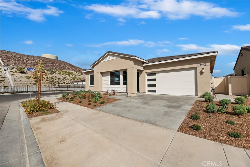 MOVE IN READY!-Altis at Skyline - An Active Adult Community by Tri Pointe Homes ~ Fall in love with single-story, open-plan living on this corner homesite. The great room is airy and bright, keeping everyone connected even while dinner is coming together in the kitchen. A second bedroom can welcome extended family or overnight guests. But wait, there’s more to love…
~Shaker-style cabinets, stained in a warm hue, with matte black pulls and light quartz counters with gray veining meet at white subway tile backsplash in the kitchen
~Luxury vinyl plank flooring, with both light and medium tones, covers the main living area; coordinating carpet, in a subtle pattern, covers bedroom floors
~Linen textured accent tile in the shower matches tile flooring in this dreamy primary bath
Live the Altis lifestyle with a community clubhouse that includes a game room, event bar, workout studio, pool, hot tub, open space, community BBQ and monthly community events! Pickleball courts, putting green, trails and more!