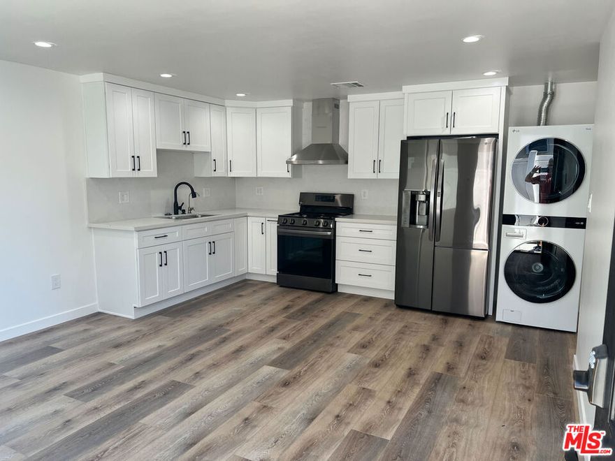 This contemporary 1-bedroom, 1-bathroom ADU, built just two years ago, offers a comfortable and private living experience with its own separate entrance and a well-designed interior layout. The unit features a modern kitchen equipped with a refrigerator and gas stove, a filtered water system, and an in-unit washer and dryer for added convenience. Additional highlights include central air conditioning and heating, bright and clean interiors with updated finishes, and approximately 470 sq. ft. of living space. All utilities, water, and electricity are included in the rent. Street parking is available.