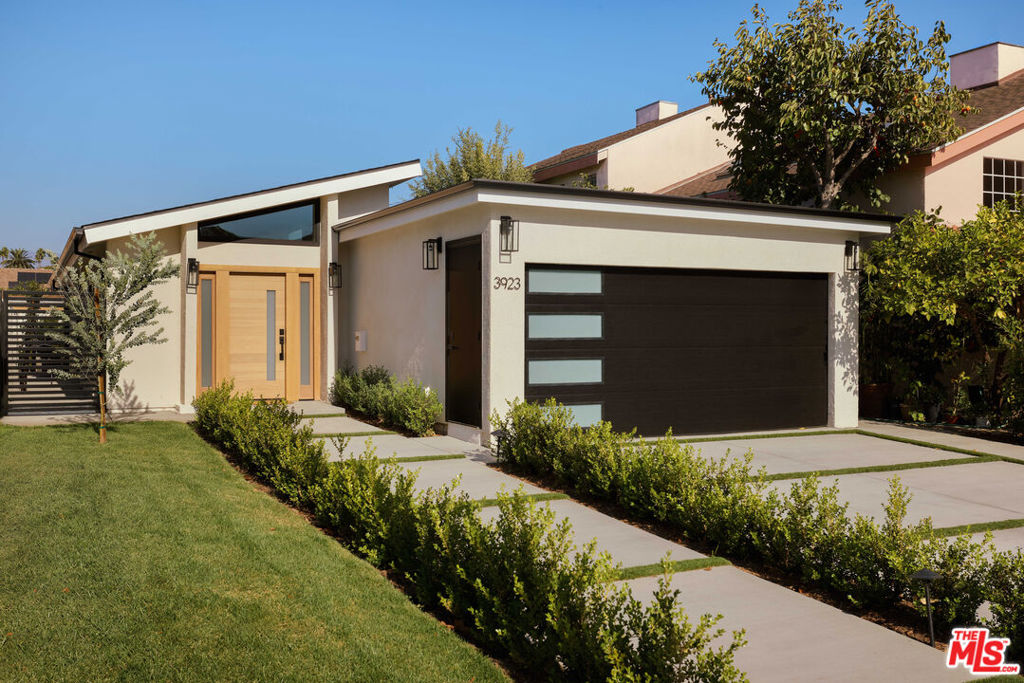 Mid-Century Modern Living in Atwater Village! Perfectly positioned between the boulevards in one of L.A.'s most desirable neighborhoods, this 4-bedroom, 3-bath home blends timeless mid-century character with modern luxury. Completely reimagined from the ground up with all-new systems, it delivers the comfort of new construction wrapped in sleek, classic design. The open-concept living area features vaulted ceilings, large-format tile floors, and clerestory windows that bathe the interior in natural light. A stunning chef's kitchen anchors the space with quartz countertops, a large island, custom cabinetry, and premium appliancesopening seamlessly to the backyard for effortless indoor-outdoor living. Thoughtfully curated details include designer bathrooms and custom built-in closets. Outside, enjoy a covered patio, drought-tolerant landscaping, and a versatile detached flex space ideal for a home office, studio, or gym. Just moments from Atwater Village's favorite cafs, boutiques, the L.A. River bike path, and Los Feliz Boulevard, this home is a modern reinvention of classic California living.