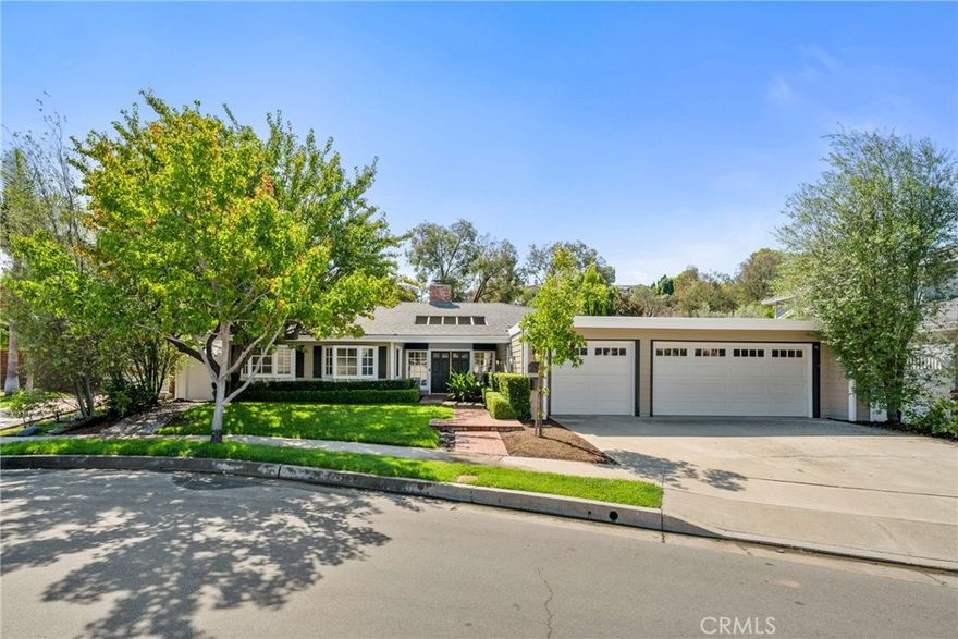 Entering past a lovely ornamental pear tree, you’ll walk on brand new hardwood floors into the spacious gourmet kitchen: Wolf range and oven, Sub-Zero fridge, full size Sub-Zero wine fridge, Bosch dishwasher, and a Dacor second oven. Granite countertops span nearly 20 feet, extending to a built-in computer station with another sliding door opening to the backyard. Great flow for entertaining. Custom pineapple motif lighting and accents, and dark wood floors extending throughout the home, evoke a subtle luxury tropical ambiance for entertaining with Ohana. Stepping through the living room, with vaulted ceiling and fireplace, the courtyard offers mature fruit trees, and a covered dining/lounging area complete with a custom Italian pizza oven, fireplace, built-in gas BBQ with concrete counters, and dedicated Holiday electrical outlets. The primary suite has been enlarged, featuring an oversized walk-in closet, custom cabinetry, soaking tub, walk-in shower with two shower heads, and a sliding glass door that opens directly to the private backyard. The three car garage has custom cabinets and storage (including a kayak/SUP rack and overhead luggage racks), work bench, Epoxy flooring, and one of the garage bays has been converted to carpeted workout room with AC, and could also be a playroom area or office.  Also: recently installed HVAC, new roof, updated plumbing and tankless hot water heater, updated electrical panel, dedicated 220V outlet for electric vehicles, and an enclosed laundry room.  Neighborhood: a private community pool and hot tub with BBQ, a private playground and basketball court, and large grassy area. Families will appreciate the easy 10-minute walk to top-rated Bonita Canyon Elementary School (10/10 GreatSchools rating). Biking distance to award-winning University High School. Turtle Rock Community Park is next door where you'll find extensive grass fields, tennis and volleyball courts, playground, a natural stream, Turtle Rock Nature and Community Center, Shady Canyon bike and jogging trail, Bommer Canyon Preserve trails, etc. Golf courses, farmers market, houses of worship, and hospitals are all a short drive or bike trip away.  Located within the top ranked Irvine Unified School District and just minutes from world-class shopping and UC Irvine, this is your chance to own a rare gem in one of Irvine’s most coveted communities.