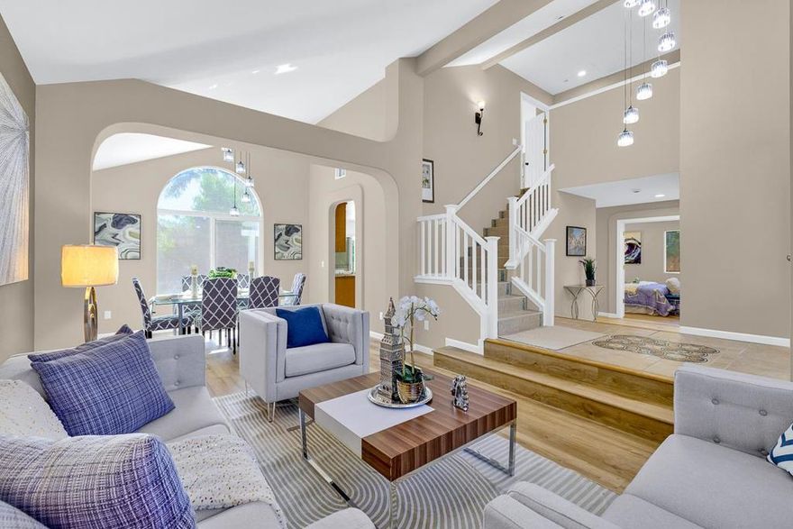 Rare 6-Bedroom Potential! Dont Miss This Spacious 5B/3B Home with 3-Car Garage in a Top-Rated School District. Welcome to this beautifully updated single-family home offering 5 bedrooms and 3 full bathrooms, located in a highly sought-after neighborhood with access to a top-rated high school. A generous upstairs loft provides the potential for a 6th bedroom, perfect for growing families or added flexibility. The home features soaring ceilings in the living room, fresh interior paint, and brand-new flooring and carpet throughout. The open-concept kitchen includes a large center island, ideal for both everyday living and entertaining. On the main level, you'll find a convenient bedroom suite, perfect for guests or multi-generational living. Upstairs offers a spacious master suite along with three additional well-sized bedrooms. The low-maintenance backyard is perfect for family gatherings and outdoor activities. With the park just a short walk away, this home delivers comfort, convenience, and a happy living experience at an affordable price. Dont miss out!