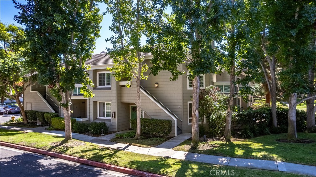 Welcome to Pacific Ranch! This newly remodeled upstairs corner unit offers 1,120 square feet of stylish living space with a serene setting surrounded by mature trees. Inside, you’ll find gorgeous hard-surface flooring throughout and an open floor plan that highlights a stunning remodeled kitchen with sleek quartz countertops, perfect for both everyday living and entertaining. The inviting living room features a cozy fireplace and access to a private balcony. The home offers two spacious bedrooms and two beautifully upgraded bathrooms, including a private primary en-suite with its own balcony. Set within the sought-after, guard-gated community of Pacific Ranch, residents enjoy resort-style amenities including a pool, spa, and lushly landscaped grounds. Ideally located just moments from downtown Huntington Beach, the pier, and award-winning schools, this home offers the ultimate combination of comfort, convenience, and coastal charm.