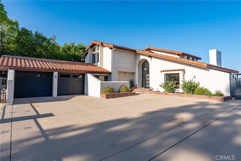 Amazing city and mountain views from this “Calabasas Park” contemporary Mediterranean Estate property located on quiet cul-de-sac street. This property offers 4 bedrooms, 4.5 baths with a private drive-in courtyard (Gated). The Kitchen has granite counters, GE built-in refrigerator, and top of the line built-in stainless appliances. There is a relaxing family room off the kitchen.and eating area, a formal dining ro0m, living room with vaulted ceilings and decorative fireplace for elegant entertaining. These rooms open to a beautiful remodeled pool /spa area with custom mahogany decking that has a commanding view of the city “Warner Center” and mountains. The Primary bedroom has a balcony with views, updated bath with soaking tub, Sauna, his and hers walk-in closets. Designer touches throughout with tasteful use of Spanish tiles, custom made Staircase, Contemporary Front-door, and black windows. . There are dual-zoned air conditioners and all dual-glazed Milgard windows. Other features include an Office with a separate entrance, custom built-in bookcases, and a mini-split, laundry room with builtin sink area, Iron Fencing with remote-controlled gate, and lockable entry, backyard surrounded with “snake” prevention fencing, dog run on the north side of the house, nest smoke/co2 detectors. Upstairs bathrooms recently updated with Black hardware, new shower valves, updated tile,etc. Great location close to “Calabasas Commons” and the Calabasas Lake, Las Virgenes Unified School District. Do not miss this opportunity to lease this great view property on one of the best streets in the Park. Pet rent per animal.